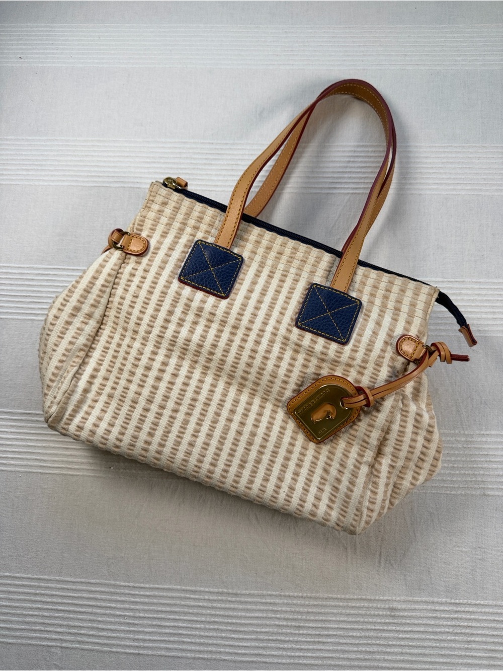 Dooney & Bourke Cream and Tan Striped Tote with Navy Accents